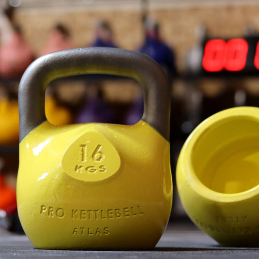 Yellow kettlebells in gym setting